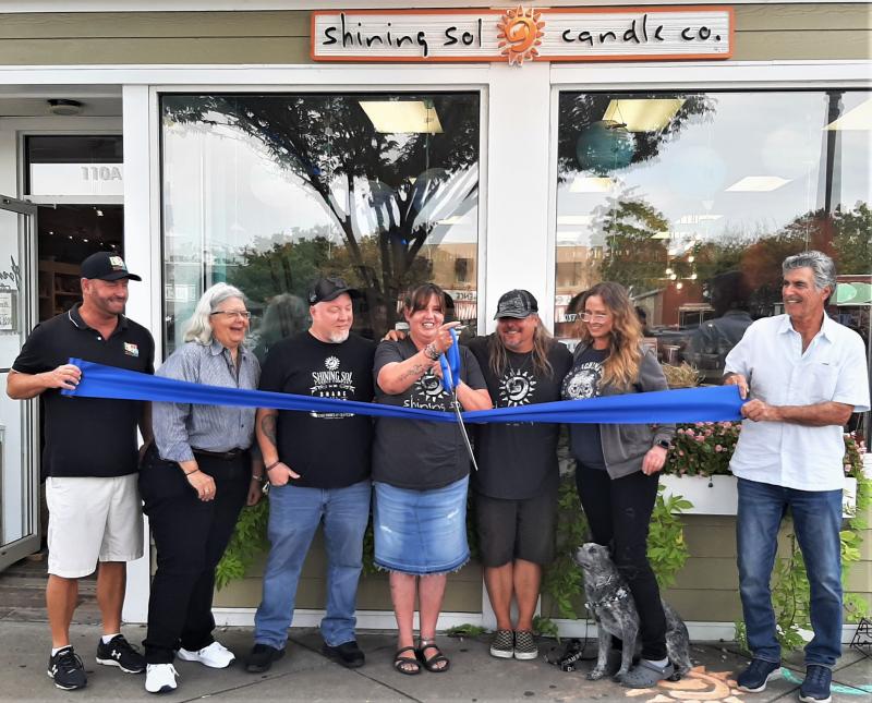 Shining Sol Candle Company ribbon-cutting attendees shown are (l-r) Dan Slagle, executive director, and Greer Maneval, president, Rehoboth Beach Main Street; Deron Blevins, owner; Carrie Gore, Rehoboth store manager; Pete Evick, owner; Tina Hobbs, warehouse manager; and Steve Curson, Rehoboth Beach Main Street board member. SUBMITTED PHOTO